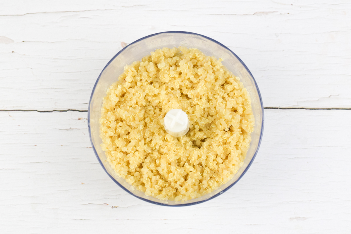 A food processor with cooked quinoa